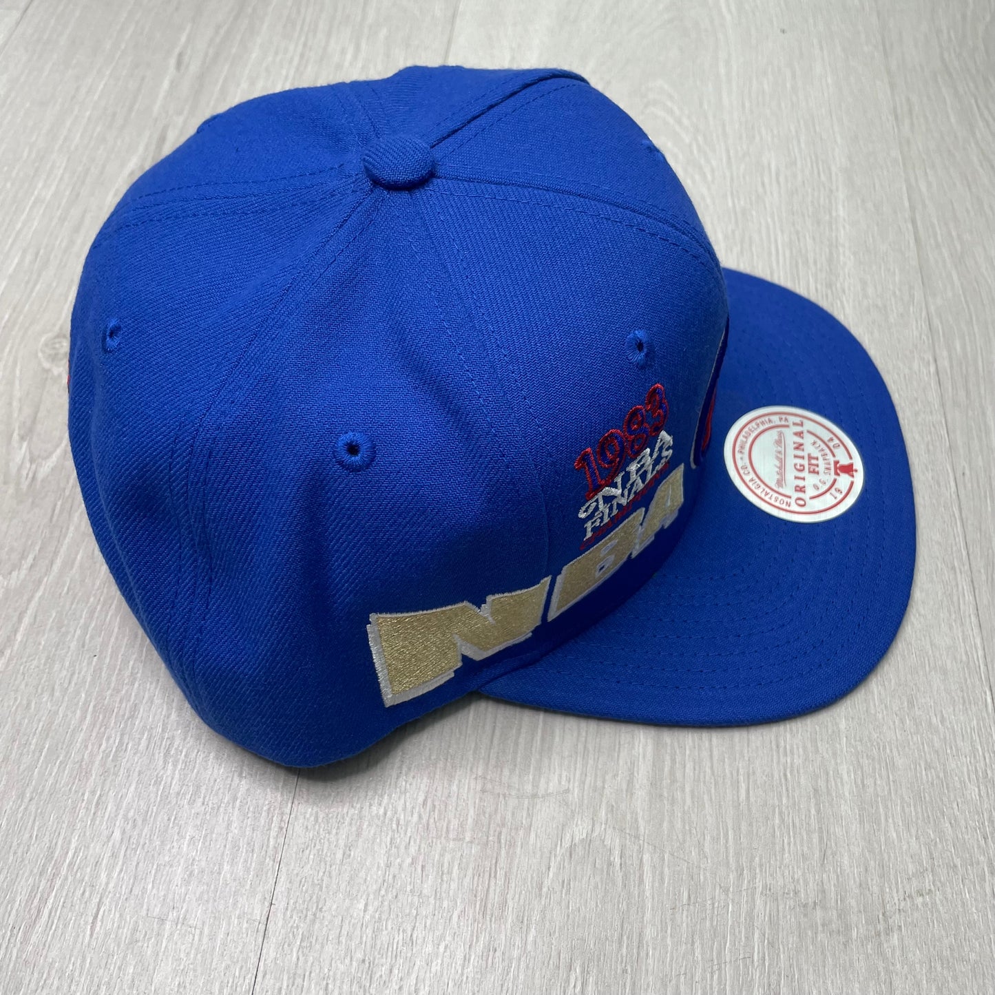 GORRA M&N 76ERS